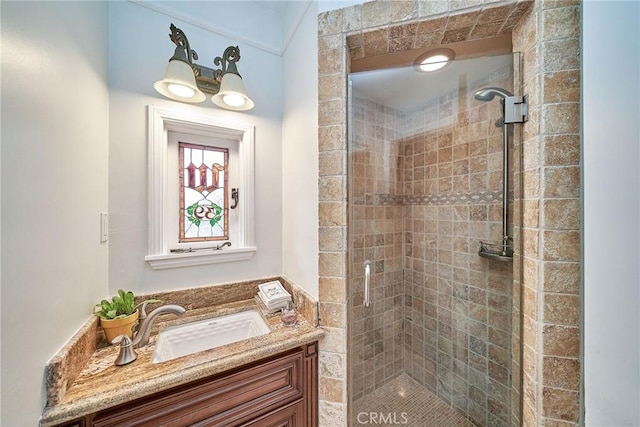 full bathroom with vanity and a stall shower