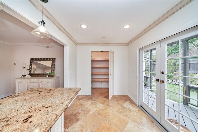 interior space featuring crown molding, recessed lighting, stone finish flooring, and baseboards