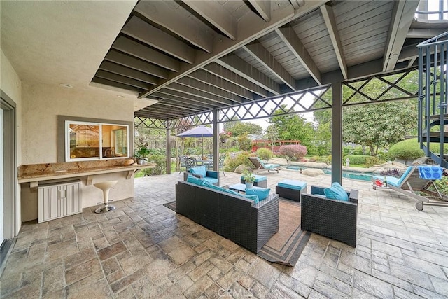 view of patio with outdoor lounge area and an outdoor pool