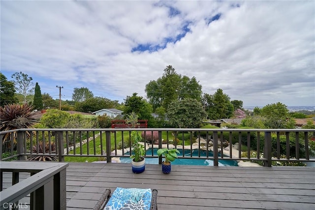 deck featuring an outdoor pool