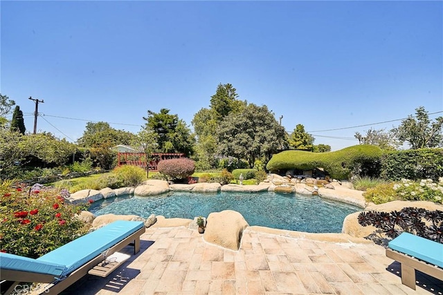 outdoor pool with a patio