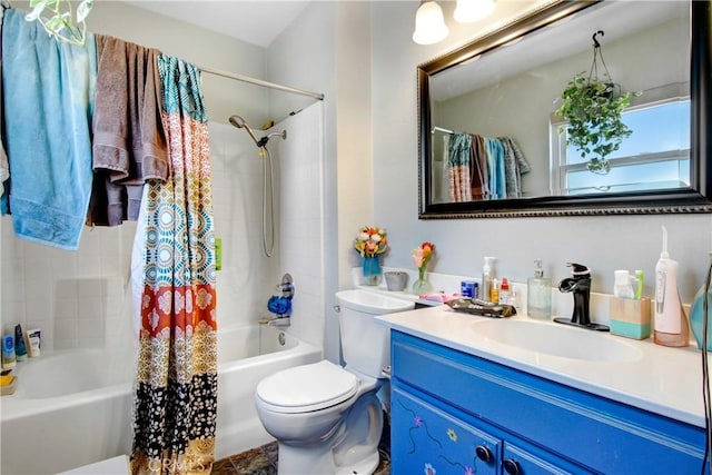 bathroom with shower / tub combo with curtain, toilet, and vanity