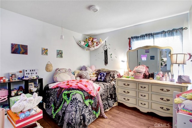 bedroom featuring wood finished floors