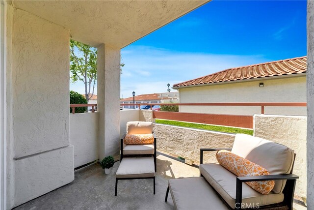 view of patio / terrace with a balcony