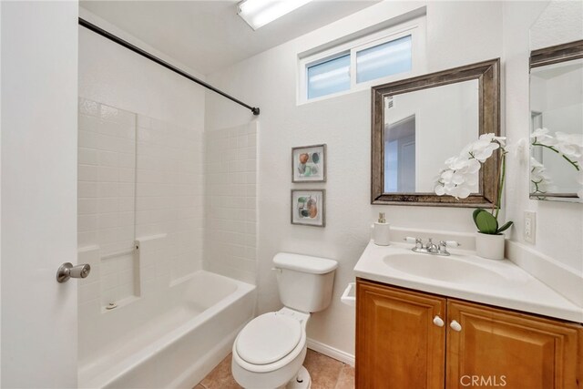 full bath featuring tile patterned flooring, toilet, vanity, baseboards, and shower / tub combination