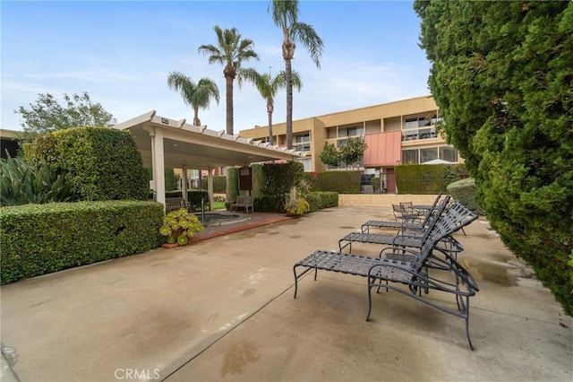 view of property's community featuring a patio area