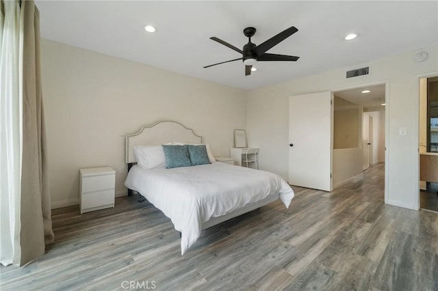 bedroom featuring recessed lighting, wood finished floors, and visible vents