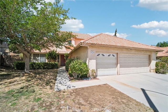 ranch-style home with a tile roof, driveway, fence, an attached garage, and stucco siding
