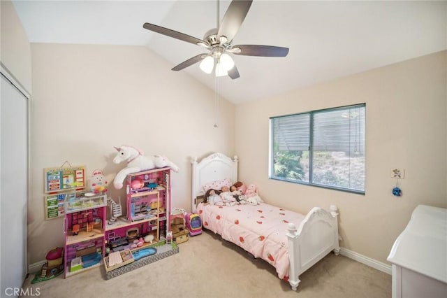 bedroom with carpet flooring, baseboards, lofted ceiling, a closet, and ceiling fan