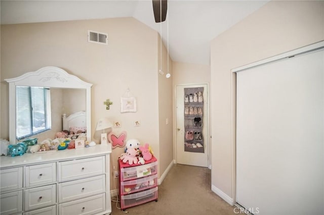 bedroom featuring lofted ceiling, visible vents, a ceiling fan, baseboards, and light colored carpet