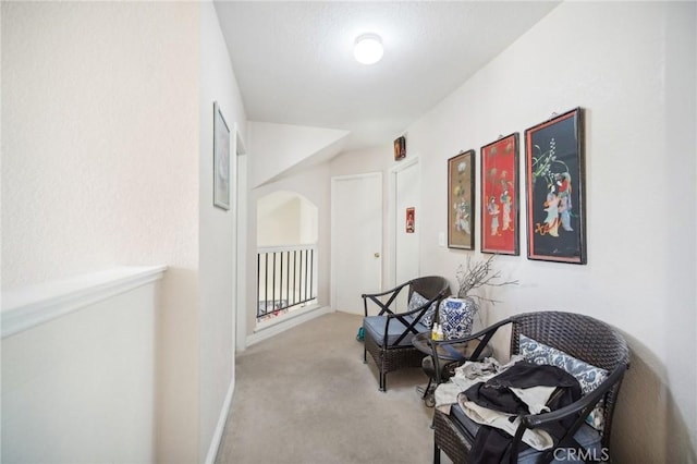 hall with carpet floors