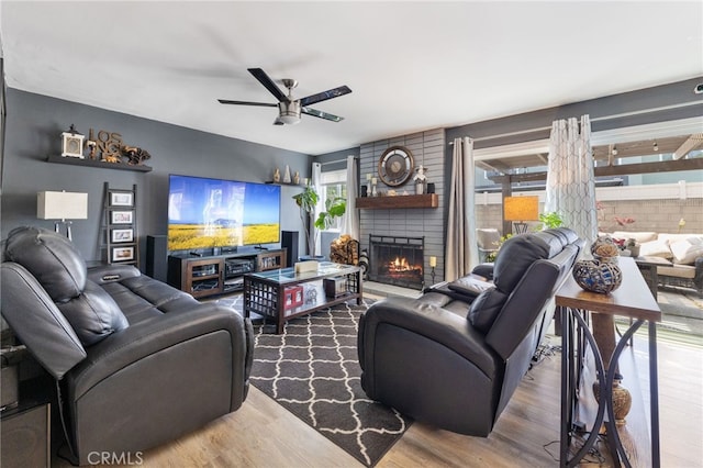 2102 Tern Bay Ln, Lakewood, CA 90712 - living room with a ceiling fan, a fireplace, and wood finished floors