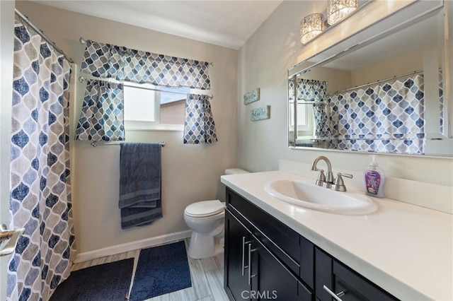 2102 Tern Bay Ln, Lakewood, CA 90712 - full bath with toilet, vanity, baseboards, and curtained shower
