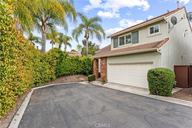 2 Astoria Ct, Aliso Viejo, CA 92656 - view of front of house featuring stucco siding, a garage, fence, and a tile roof