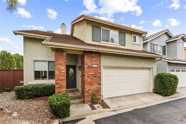 2 Astoria Ct, Aliso Viejo, CA 92656 - view of front of house with a garage, fence, stucco siding, brick siding, and a chimney