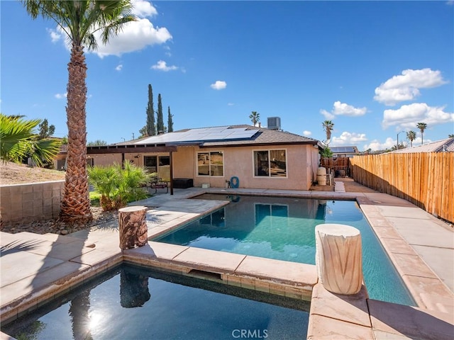view of pool with a fenced backyard, central air condition unit, a patio area, and a fenced in pool