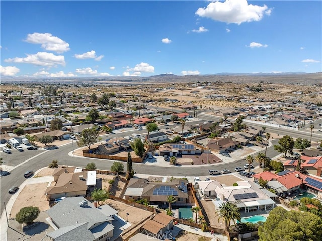 drone / aerial view featuring a mountain view and a residential view