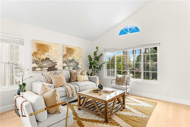 20163 Corona St, Corona, CA 92881 - living area with wood finished floors, vaulted ceiling, and baseboards