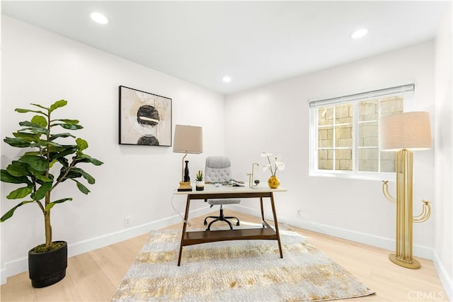 office space with wood finished floors, recessed lighting, and baseboards