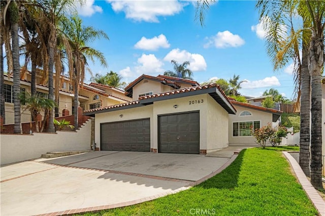 20163 Corona St, Corona, CA 92881 - view of front of home with stucco siding, a garage, driveway, a front yard, and a tile roof