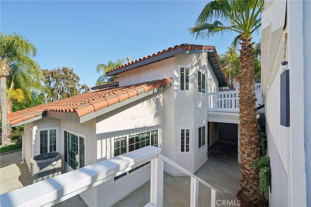 20163 Corona St, Corona, CA 92881 - back of house with a tiled roof, a balcony, and stucco siding