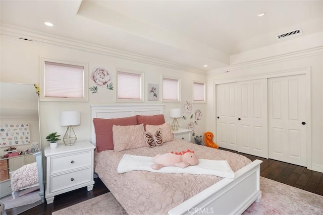 9 Pembroke Ln, Laguna Niguel, CA 92677 - bedroom with dark wood-style floors, a closet, a tray ceiling, recessed lighting, and crown molding