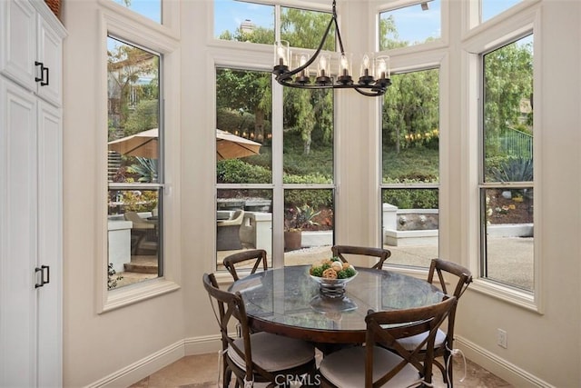 9 Pembroke Ln, Laguna Niguel, CA 92677 - dining space featuring a chandelier and baseboards