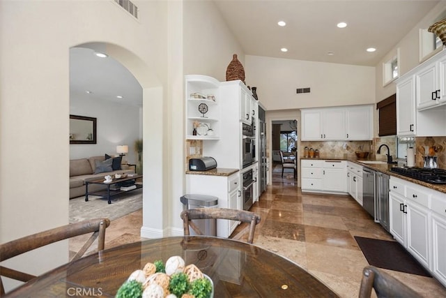9 Pembroke Ln, Laguna Niguel, CA 92677 - kitchen featuring open shelves, a sink, stainless steel appliances, white cabinetry, and high vaulted ceiling