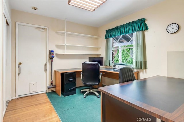 home office with wood finished floors
