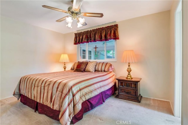 bedroom with ceiling fan and carpet floors