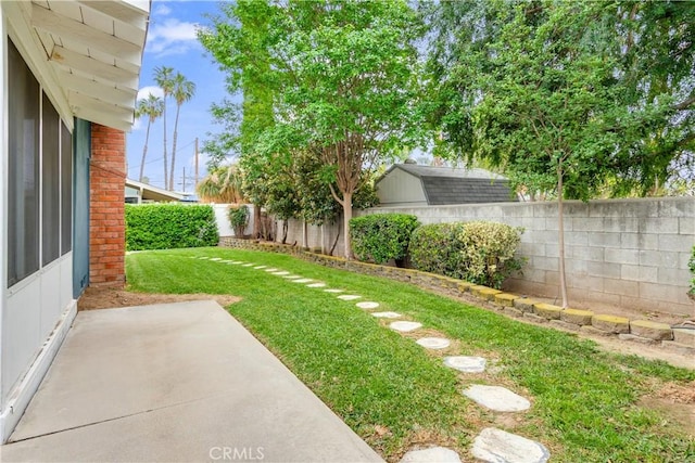 view of yard featuring a patio and a fenced backyard
