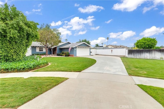 ranch-style house featuring a gate, concrete driveway, fence, a front yard, and a garage