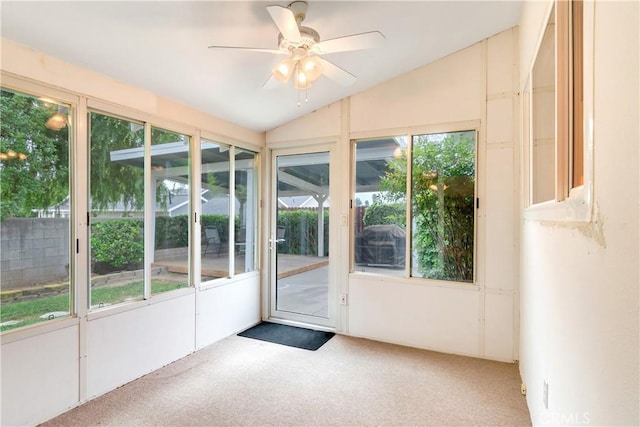 unfurnished sunroom with a ceiling fan