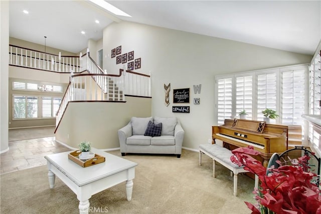 living area featuring stairway, baseboards, recessed lighting, and high vaulted ceiling