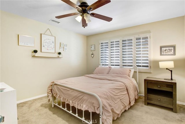 bedroom with baseboards, a ceiling fan, carpet flooring, and visible vents