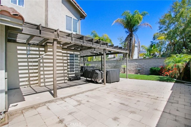 view of patio with fence and a pergola