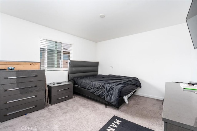 bedroom with light carpet