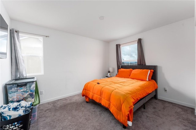 bedroom with carpet floors and baseboards