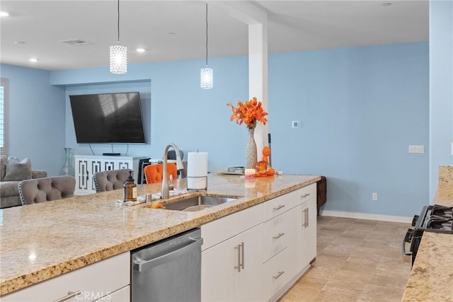 kitchen with stainless steel dishwasher, range with gas stovetop, baseboards, white cabinetry, and a sink
