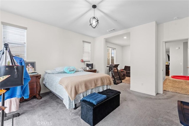 bedroom featuring baseboards, carpet, and visible vents