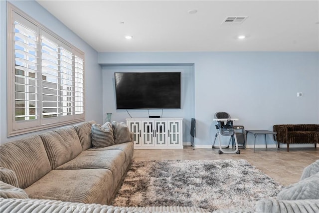 living area with recessed lighting, baseboards, and visible vents