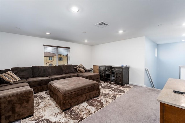 carpeted living area featuring recessed lighting, baseboards, and visible vents