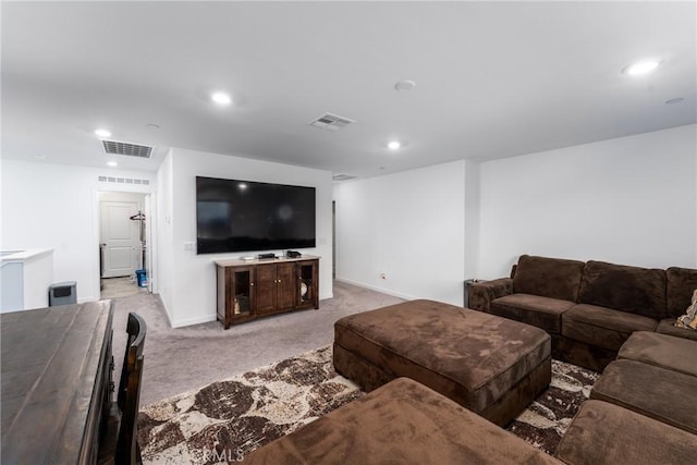 living area featuring baseboards, visible vents, recessed lighting, and light colored carpet