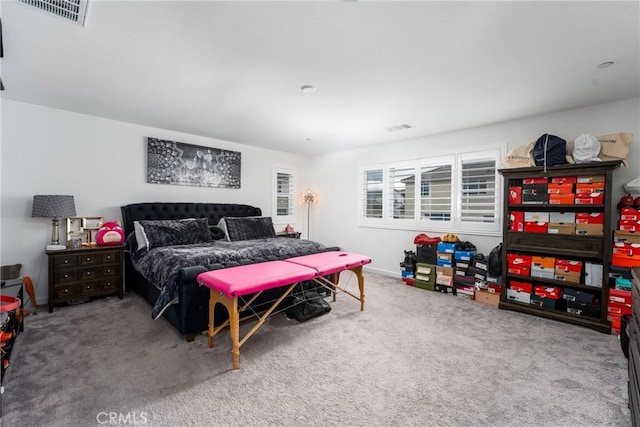 bedroom featuring carpet floors, baseboards, and visible vents