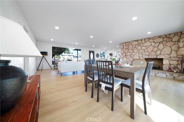 14816 Lanning Dr, Whittier, CA 90604 - dining room featuring light wood finished floors, recessed lighting, and a stone fireplace