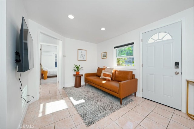 living room with baseboards, recessed lighting, and light tile patterned flooring