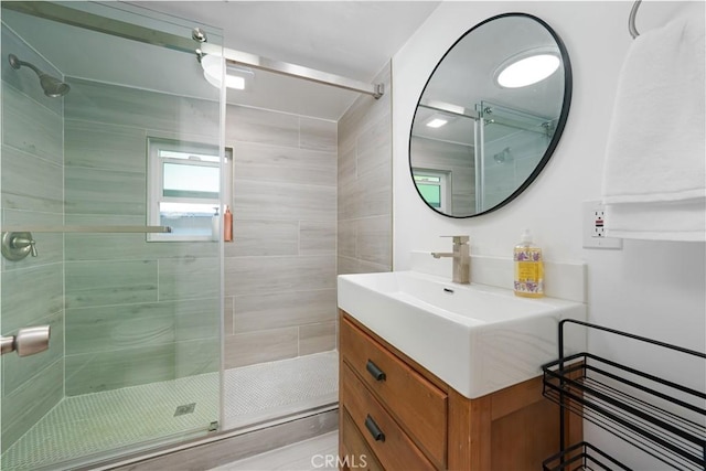 full bath with vanity and a stall shower