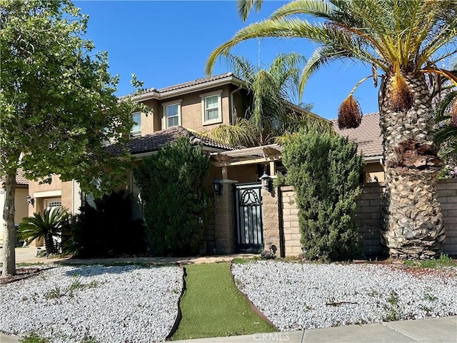 38728 Falkirk Dr, Murrieta, CA 92563 - obstructed view of property featuring stucco siding and a tiled roof