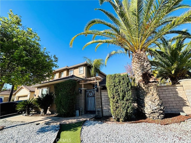 38728 Falkirk Dr, Murrieta, CA 92563 - view of property hidden behind natural elements with stucco siding