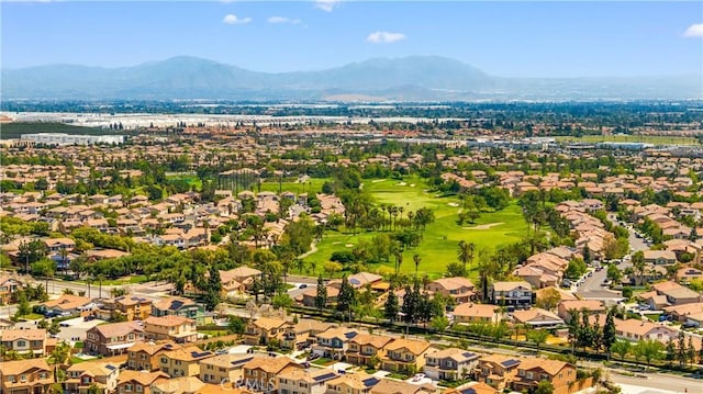 birds eye view of property with a residential view, view of golf course, and a mountain view
